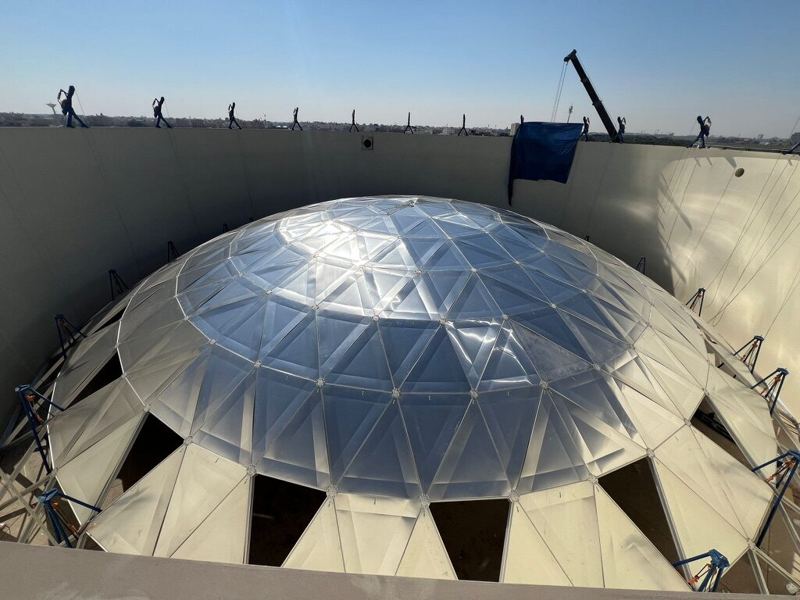 Aluminum geodesic dome cover constructed over a large shop-welded steel tank