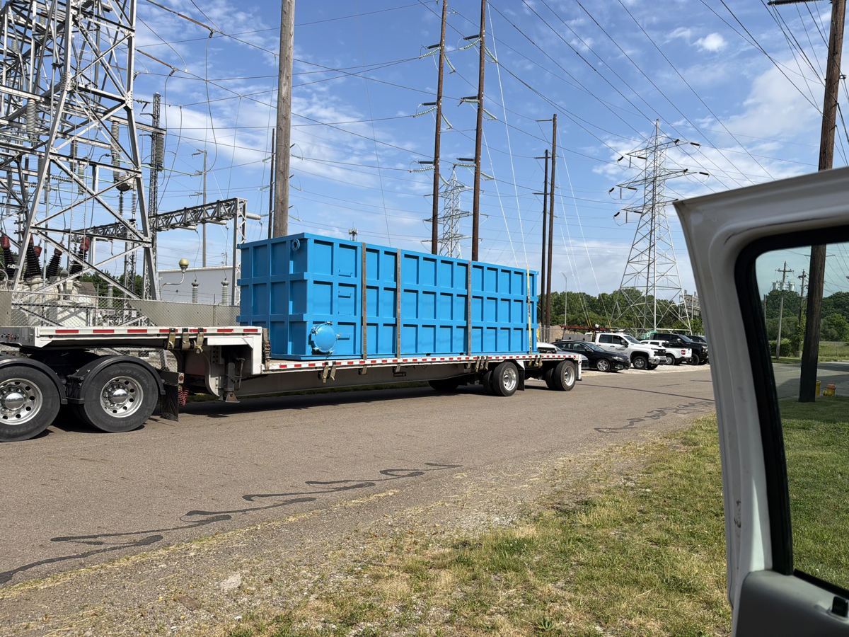 EnviroBox modules shipped on flatbeds and field-set off the truck