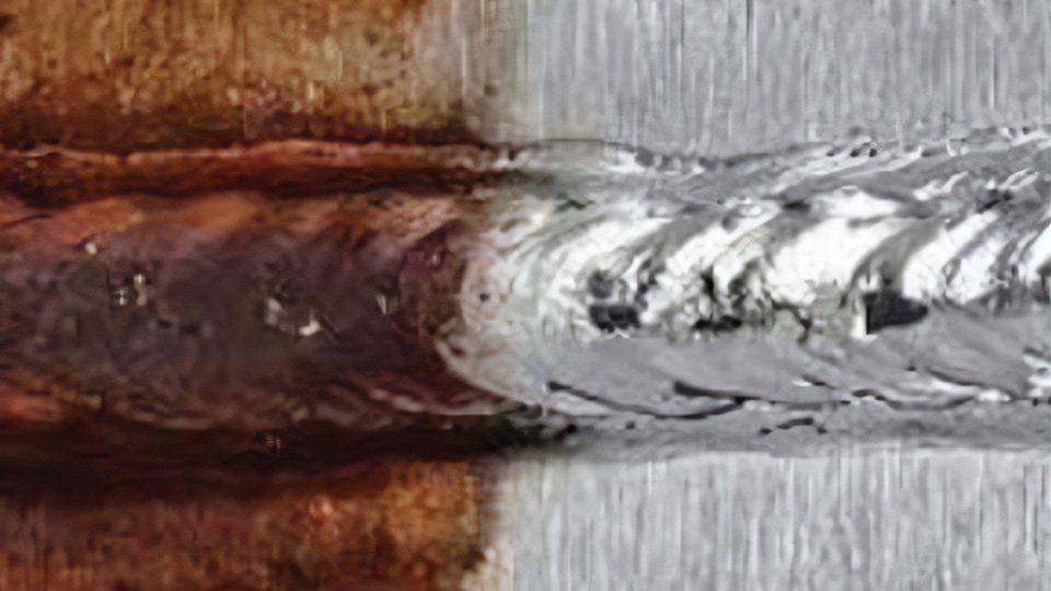 Passivation contrast on a stainless weld: bright re-passivated surface versus heat-tinted oxide