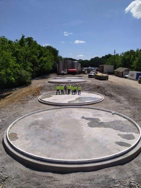 Engineered concrete ringwall foundations sized to the soil and load to keep the shell from settling unevenly