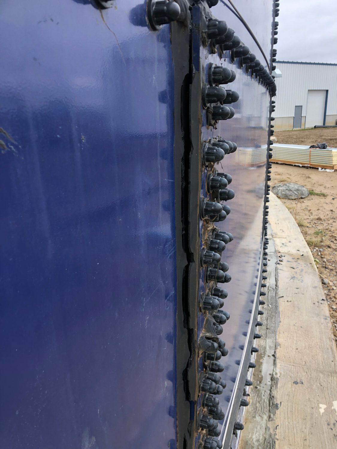 Bolted vertical seam and fastener line on a glass-fused-to-steel tank