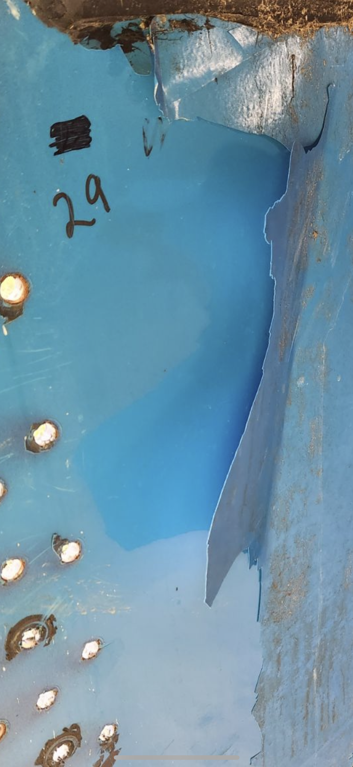 Blue tank interior coating with a patch repair and field marking