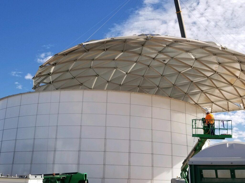 Overhead view of a translucent aluminum geodesic dome cover showing the triangulated panel pattern