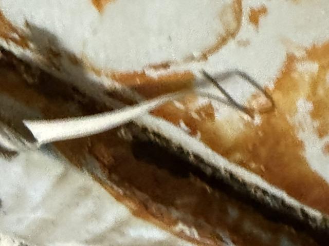 Interior tank lining peeling away from corroded steel