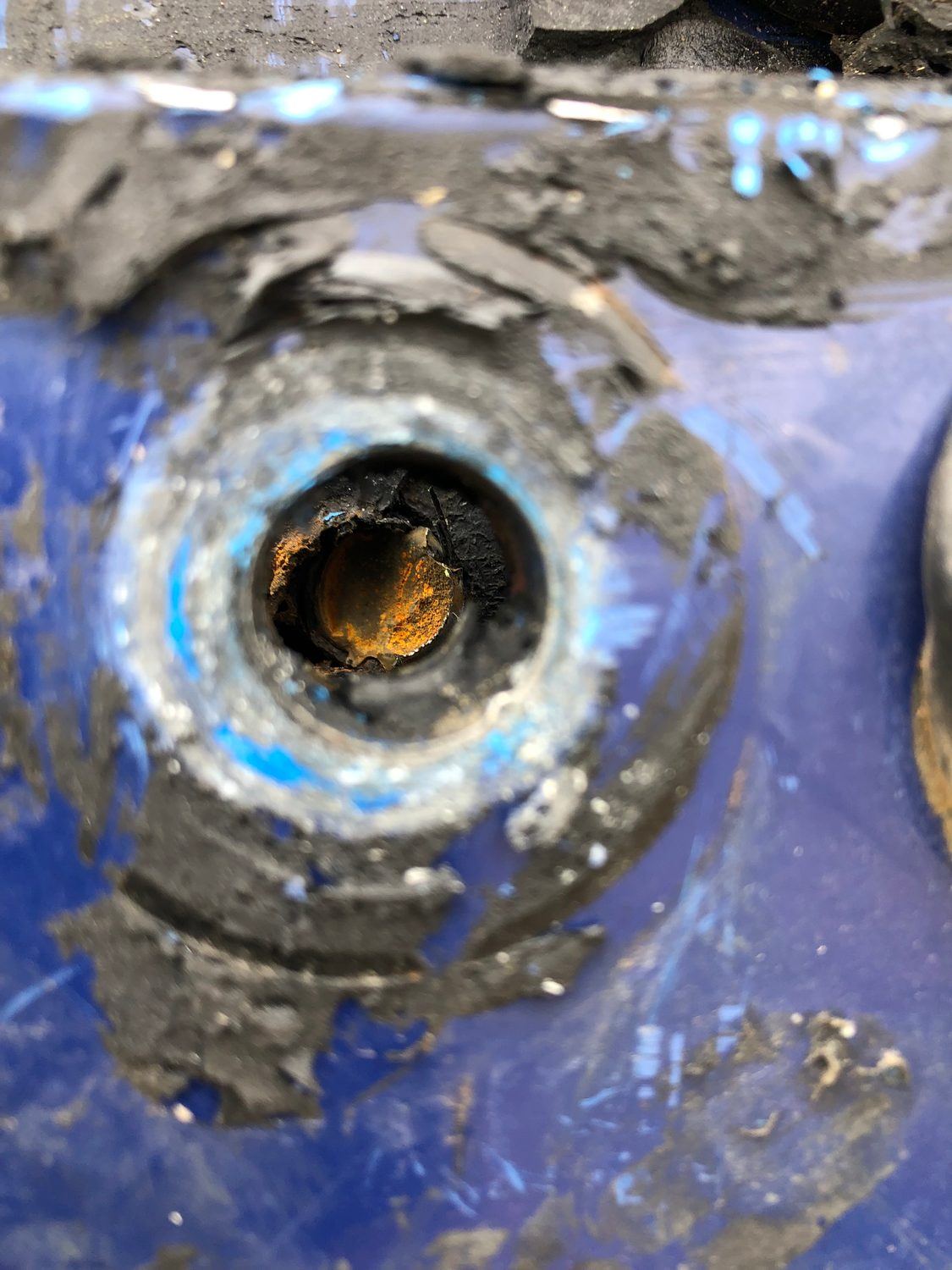 Corroded tank penetration and pipe detail documented during condition assessment