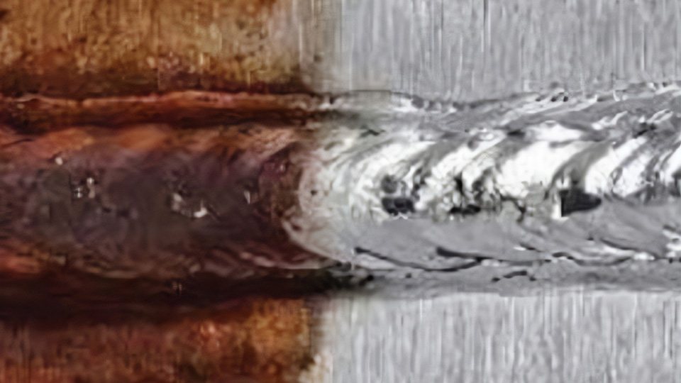 Passivation contrast on a stainless weld: bright re-passivated surface versus heat-tinted oxide