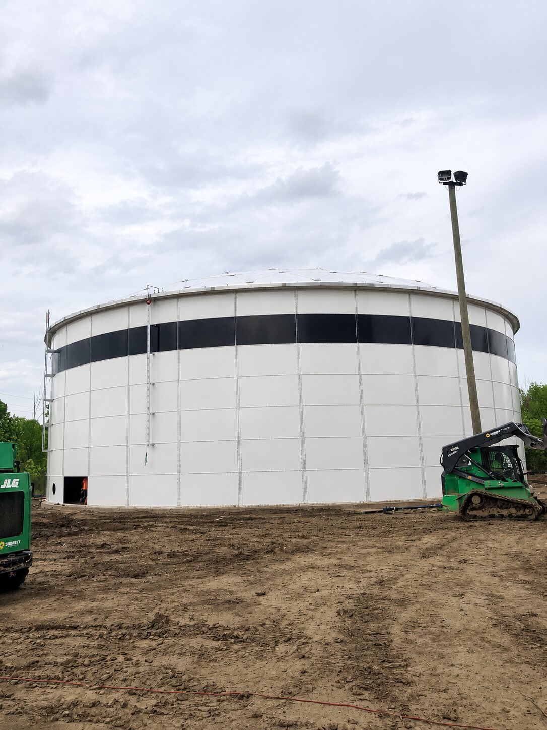 Bolted steel tanks with exterior stair access and site piping