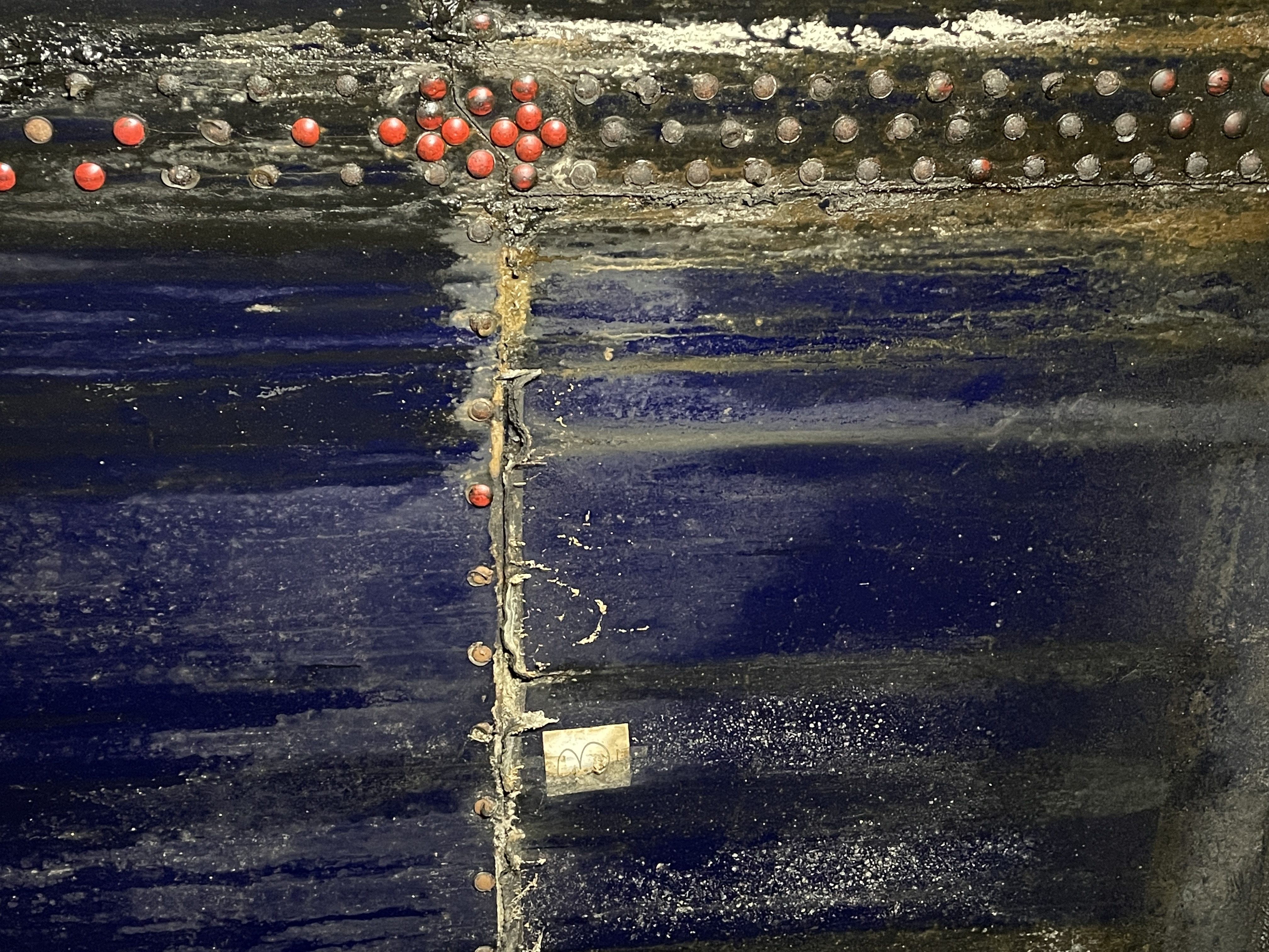 Forensic view of advanced corrosion on the interior steel wall of a storage tank