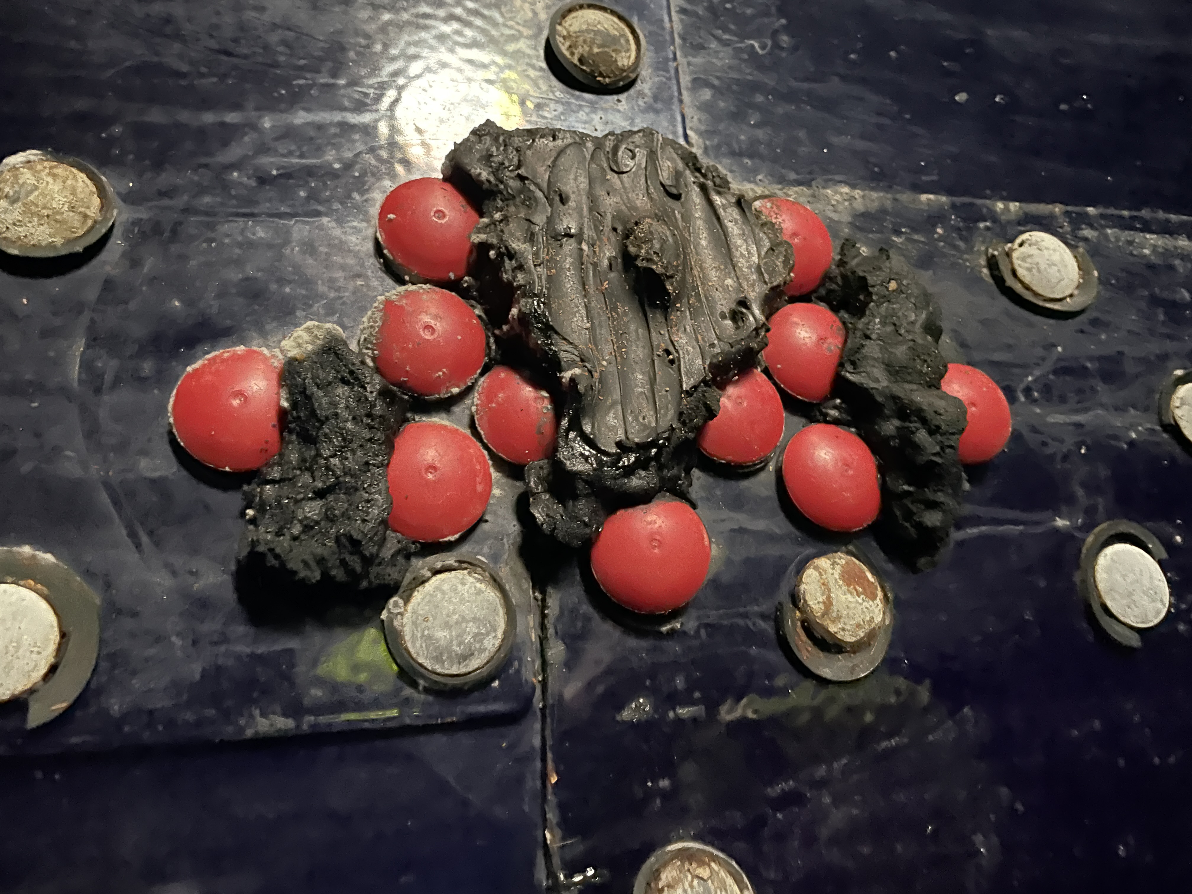 Detail of mastic sealant degradation at a bolted seam